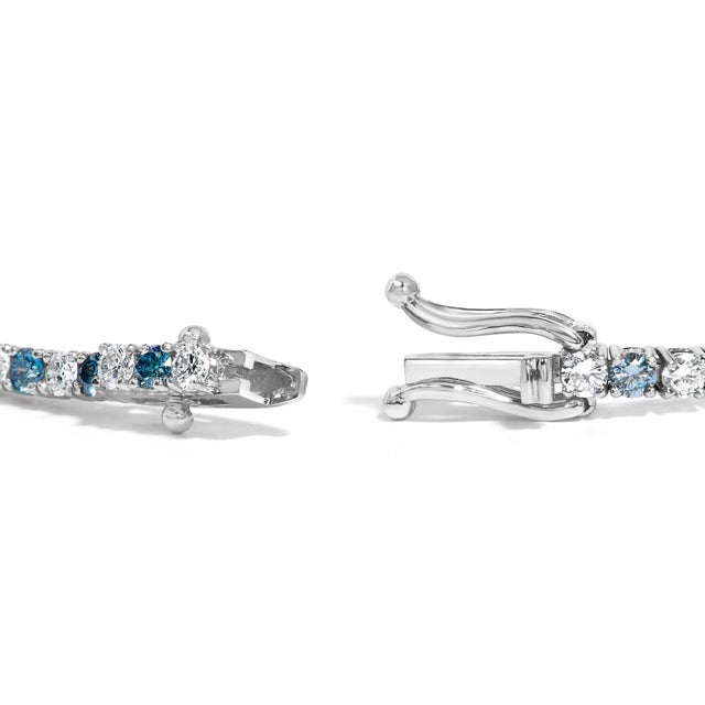 Immaculately crafted to adorn your wrist with a touch of timeless elegance, this bracelet boasts lab-grown diamonds...