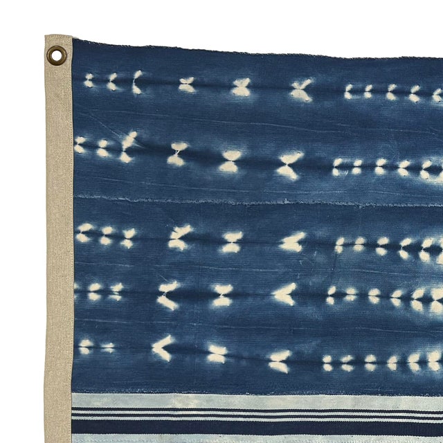 This unique cotton flag is made from vintage African textiles. The shibori dye and hand-stitching are original, and...