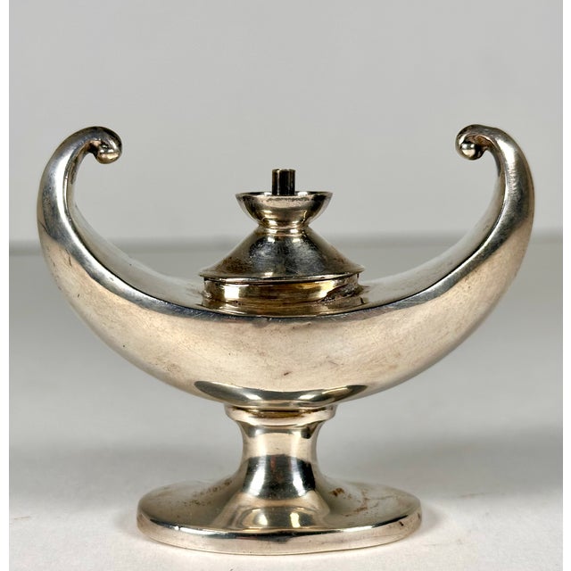 Antique Sterling Aladdin Lamp Cigar Lighter for your consideration. The lighter measures approx. 2 3/8 inches tall, 2 3/4...