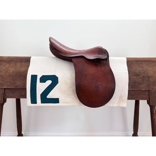 Here is a vintage racehorse saddle cloth (saddle pad) circa 1960s. The off-white saddle cloth is made of canvas and...