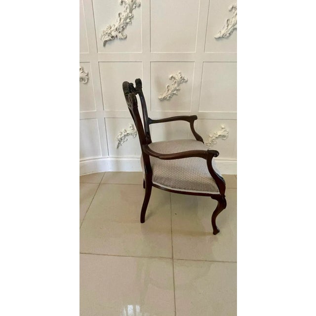 Quality Victorian mahogany carved elbow chair with an elegant shaped and beautifully carved top rail and a finely carved...