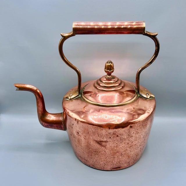 A large substantial george iii copper kettle, england circa 1800, entirely hand-riveted and dovetailed. the design...