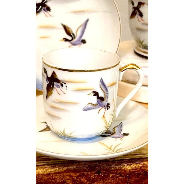 Experience tea-time with 4 teacup sets featuring hand-painted ducks in flight. This antique collection, including a...