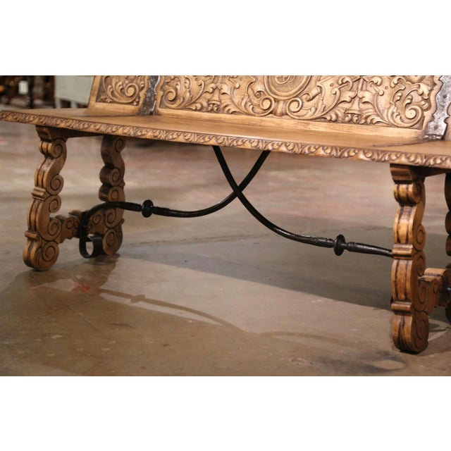 This handsome antique folding bench was crafted in Spain circa 1880 and reflects the bold architectural character of the...