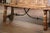 This handsome antique folding bench was crafted in Spain circa 1880 and reflects the bold architectural character of the...