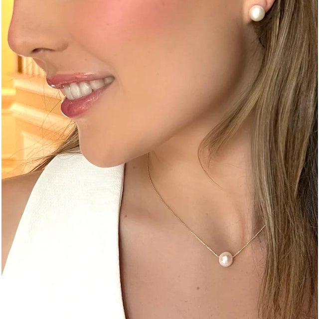 This ultra petite necklace is crafted with a freshwater pearl and gold filled necklace