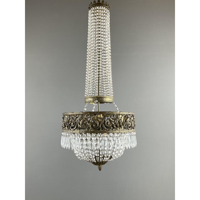 Antique Chandelier in Bronze and Crystal Drops, 1890s, in Flawless conditions. Designed 1890 to 1919 European Plug (up to...