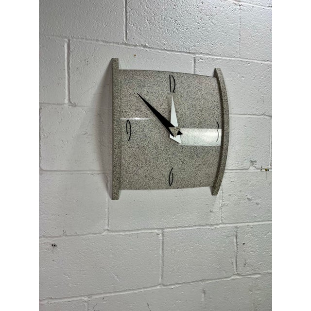 Striking vintage Postmodern wall clock by Empire, dating to the 1980s. The sculptural case features a gray-and-black faux-...