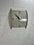 Striking vintage Postmodern wall clock by Empire, dating to the 1980s. The sculptural case features a gray-and-black faux-...