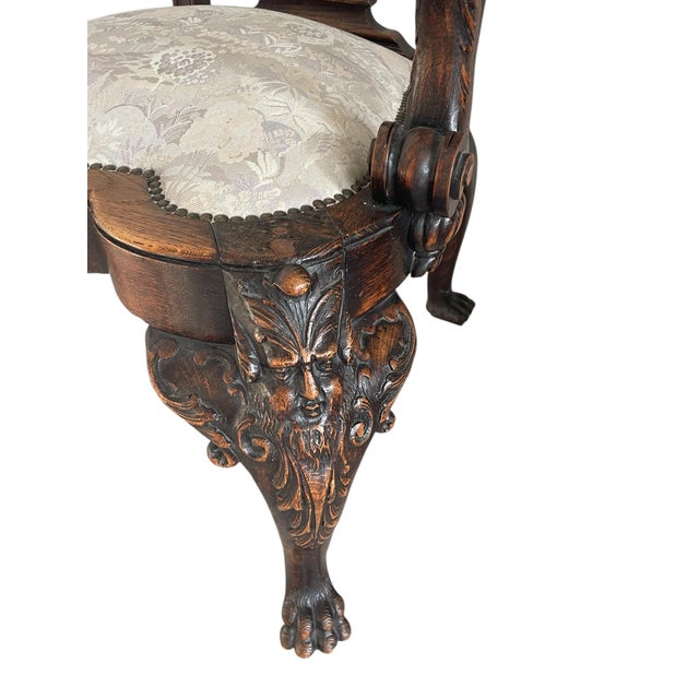 The front cabriole legs having very ornate face masks. The arms supported by eagle figures. Arms and back decorated with...
