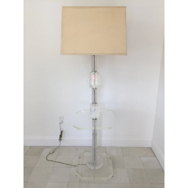 Lucite and glass floor lamp in the style of Hollywood Regency. Corner Cut Lucite cube and frosted glass. In excellent...