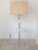 Lucite and glass floor lamp in the style of Hollywood Regency. Corner Cut Lucite cube and frosted glass. In excellent...