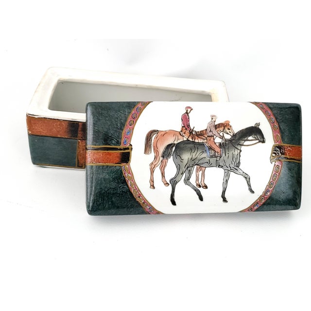 Offering a sophisticated vintage equestrian Chinese porcelain box, circa Mid 20th Century. This unique hand painted box...