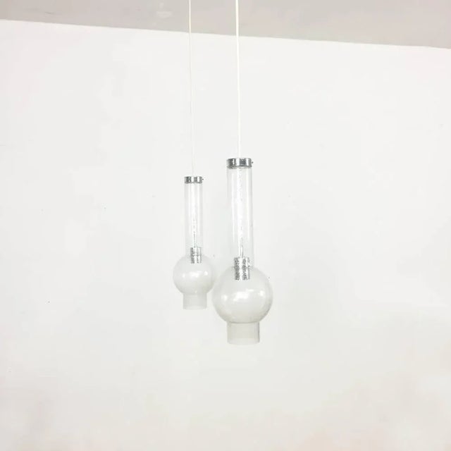 Set of two tubular pendant lights. Hand blown glass. Producer Staff Lights, Germany, 1970s. Original 1970s set of two...