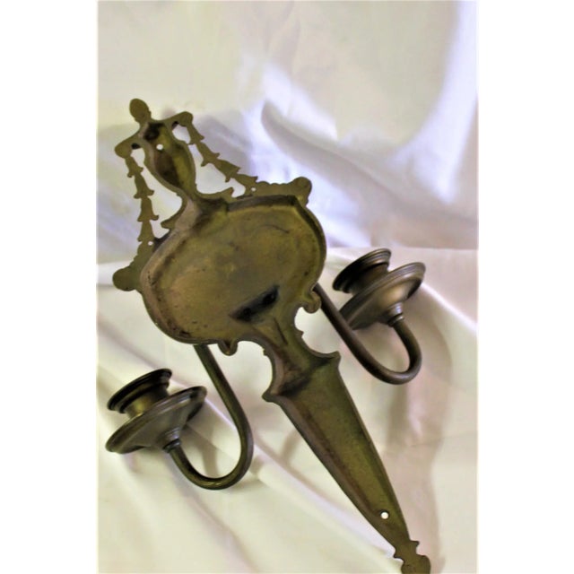 Traditional looking sconces. Two arms. Solid brass castings and brass tubing. American or English design. 15" in length...