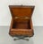 An ornate decorative sewing or storage box featuring a warm wood case with a hinged leather-lined lid and carved foliate...