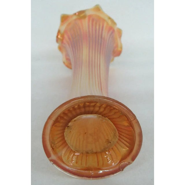 This gorgeous vase is made of carnival glass. This vase is made in the great Fine Rib style made famous by Fenton; it...