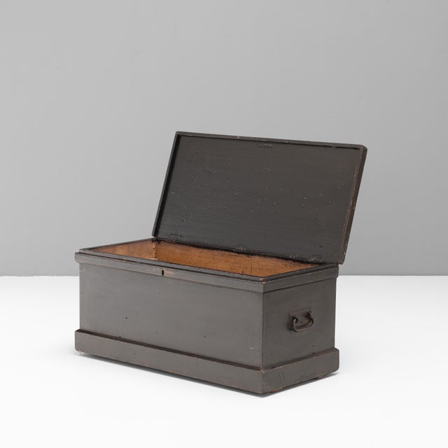 Lidded pine trunk in repainted finish. Circa 1890.