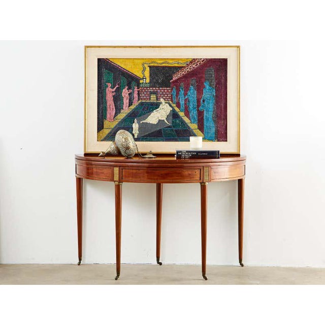 Fine 19th century flip topgames table, card table, dining table, or console table featuring a demilune form. Crafted from...