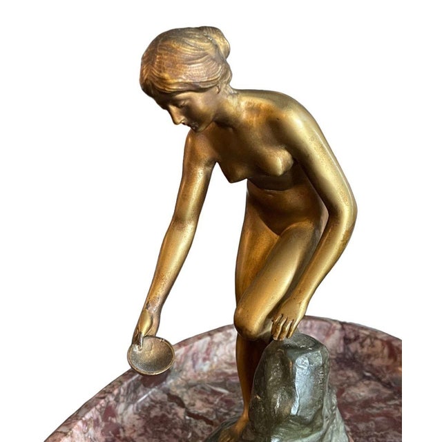 An elegant sculptural centerpiece by Percimer Rudolfi (Germany, 1884–1932), featuring a finely cast two-tone bronze nude...