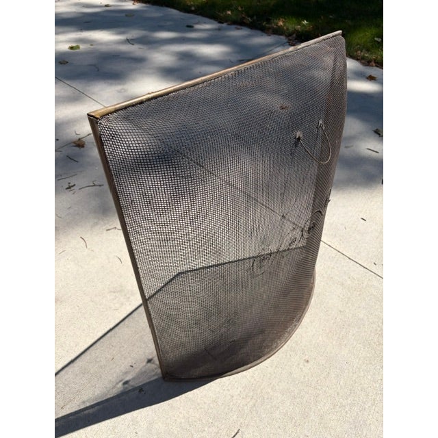 Vintage rounded fireplace screen with brass rim that features the French "Gendarme" Curve: The curved dome shape allows...
