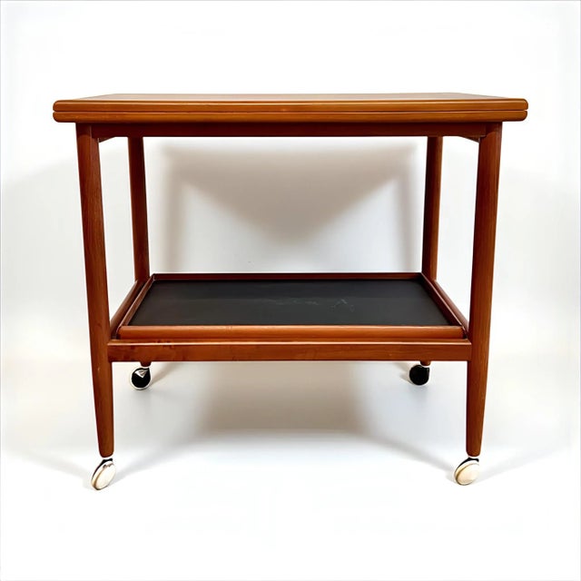 An exclusive, timelessly modern, and elegant danish side table/coffee table/serving cart, an original first-class vintage...