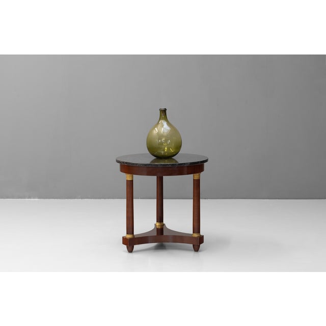 French mahogany Empire style marble top gueridon. Circa 1930.