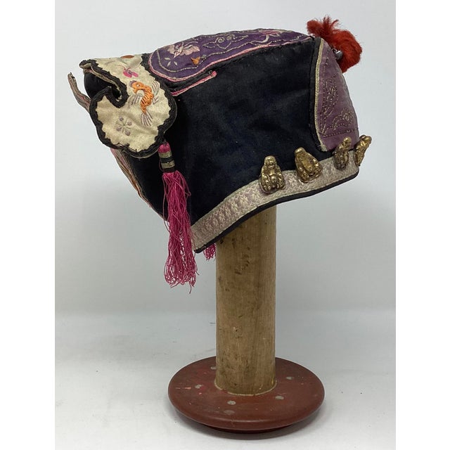 The scholar’s hat is full of symbolism to protect the child against evil and imbue them with important qualities such as...