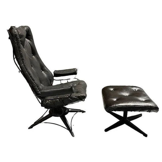 Mid-century Eames-inspired highback black wrought iron springer Lounge Chair with matching ottoman by Homecrest, featuring...