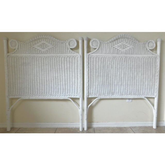 Lovely pair of vintage circa 1980s ornate white wicker twin sized headboards. Sweet design. Circa 1980s. White wicker and...