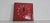 Red ceramic wall clock. Made in Germany in the 1970s