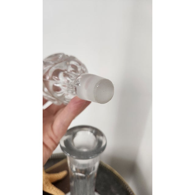 A vintage Bohemian cut crystal decanter featuring brilliant hobstar and cross-cut decoration, a star-cut base, and a...