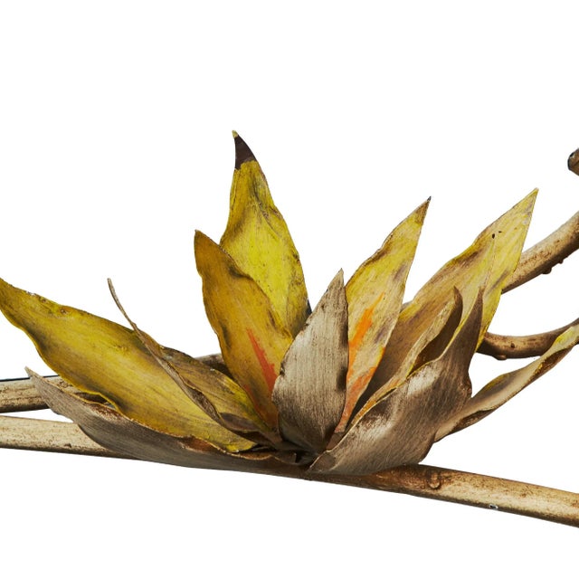 This 1970s rectangular Wrought Iron Coffee Table is painted rustic white and features a painted lotus flower with branches...