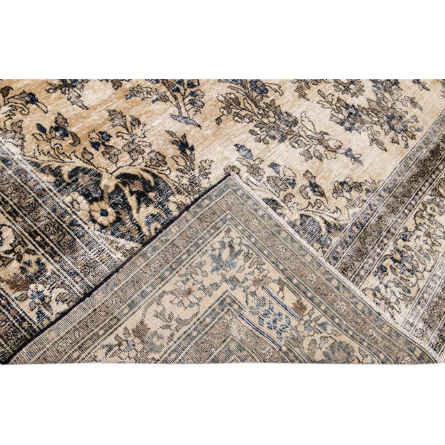 Beautiful Vintage Persian distressed hand-knotted wool rug with an ivory color field. This Persian rug has a beige frame...