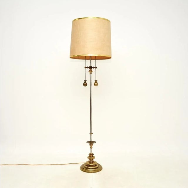 An amazing vintage Italian brass and steel floor lamp, dating from the 1970’s. This has an incredibly stylish and clever...