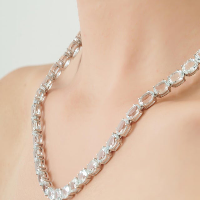 This elegant 19th-century-style aquamarine jewelry set features an 18-inch rivière necklace accompanied by a coordinating...