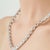 This elegant 19th-century-style aquamarine jewelry set features an 18-inch rivière necklace accompanied by a coordinating...