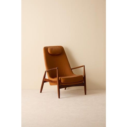 High-back Ib Kofod-Larsen "Seal" / "Sälen" easy chair. Produced by OPE. Newly reupholstered in leather. This piece is...