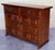 From Northern Spain, constructed of solid walnut, the rectangular top with molded edge atop a conforming case housing two...