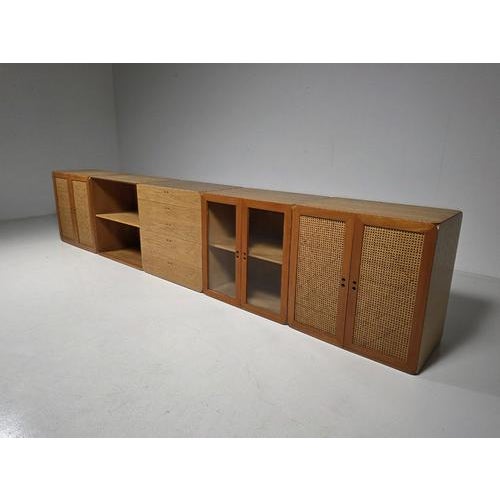 Modular wooden samara storage wall unit by dutch designer derk jan de vries, created in the 1970s. This modular storage...