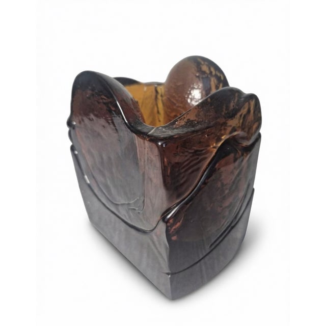 This piece is a Mid-Century Modern sculptural amber art glass vase. It was produced by the famous Czech glass studio Exbor...