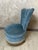 An elegant armchair dating from the 1950s, entirely upholstered in a beautiful blue velvet with subtle highlights. Its...