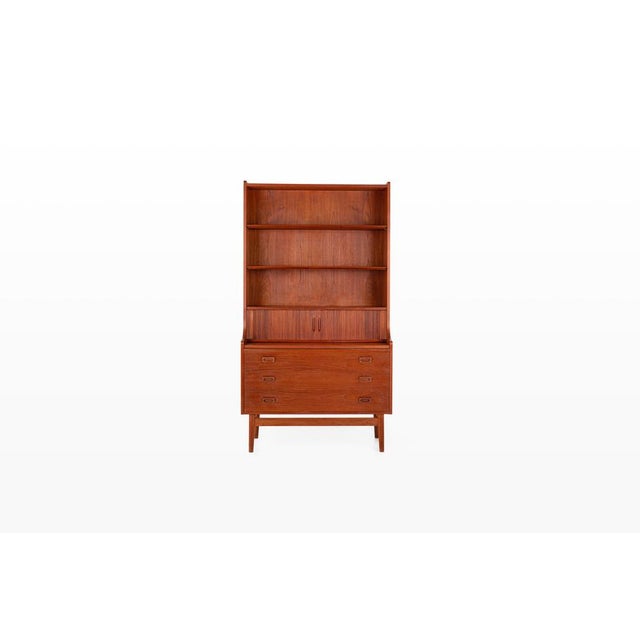 Danish vintage bookcase / secretary desk designed by Johannes Sorth for Nexø, 1960s. This versatile mid-century modern...