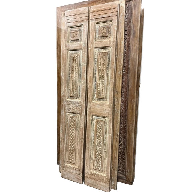 Elevate your space with these antique hand-carved floral French doors, beautifully crafted from solid wood and rich with...