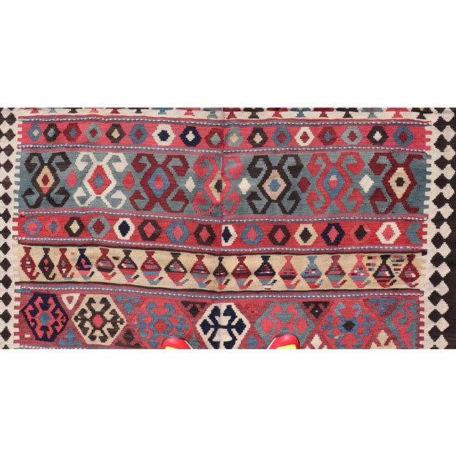 Early 20th Century Persian Kilim Rug With Bold Tribal Geometric Patterns in Vivid Colors 4'9 X 6'9 For Sale - Image 5 of 13