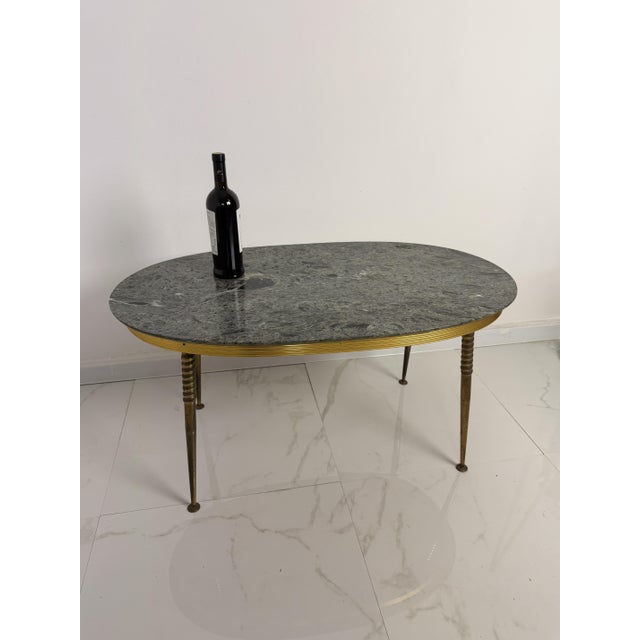 Oval brass coffee table with a green marble top, 1950s. Intact and in good condition. Found in a noble apartment in my...