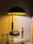 Epic 1930s Karl Trabert designed metal dome desk lamp in black and yellow. The piece is an excellent study in Bauhaus...