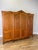 A beautifully presented Vintage French Louis wardrobe in oak, featuring four shaped panelled doors decorated with elegant...