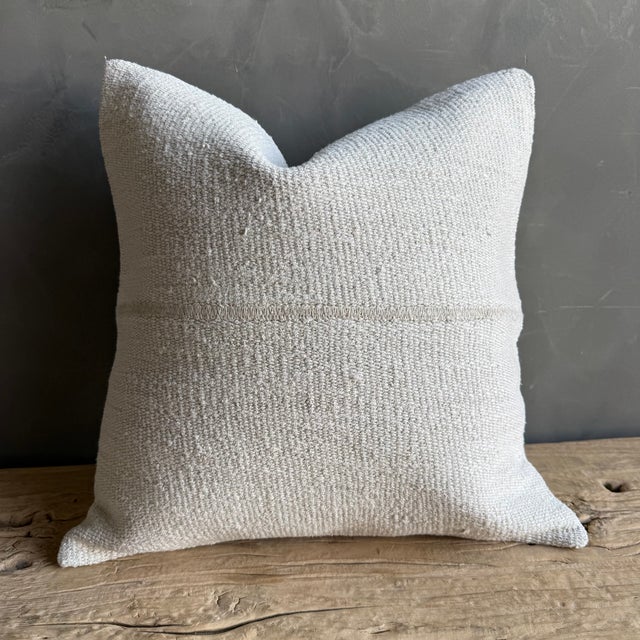 Creamy white hemp rug pillow. Soft hand, linen blend backing with zipper closure. Spot cleaning is recommended, or dry...