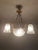 Bring timeless french elegance into your home with this magnificent art deco bronze and frosted glass chandelier....